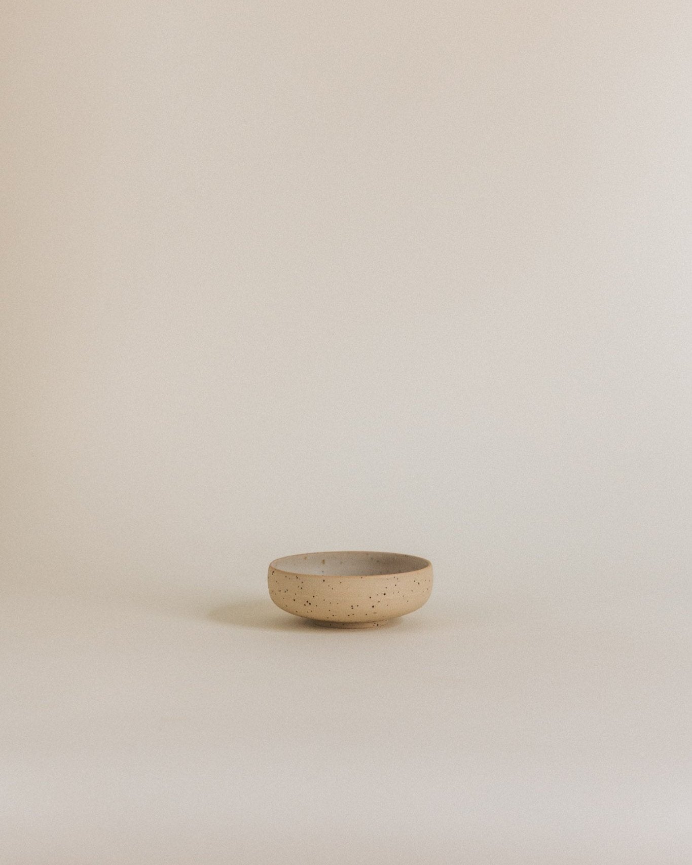 Tiny bowl in sand