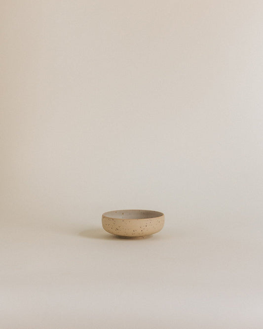 Tiny bowl in sand
